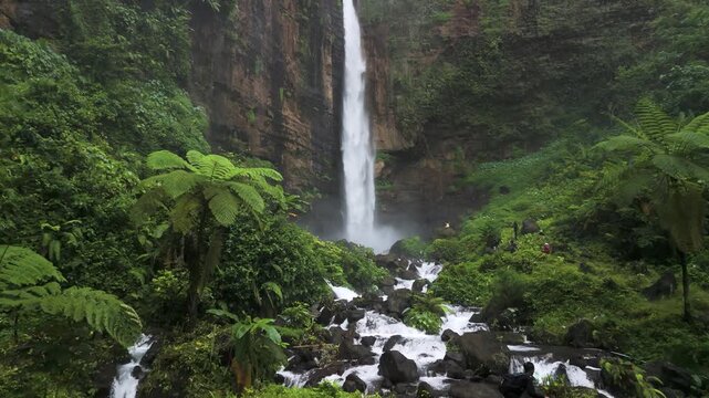 Java Island Indonesia Stunning Drone Shot of Kapas Biru Waterfall and Lush Green Canyon