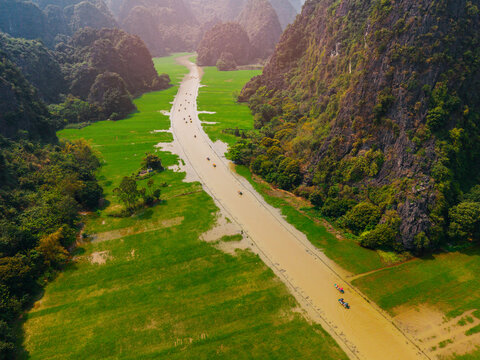 Scenic aerial view of tam coc river and lush landscapes in Ninh Binh, Vietnam