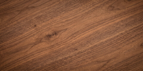 Fototapeta premium A rich, warm, and textured wooden surface displaying natural grain patterns, perfect for a rustic or natural aesthetic.