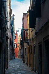 Fototapeta premium Narrow street in Venice or Venezia, Italy