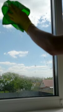Washing windows spring cleaning. Selective focus.
