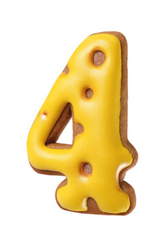 Gingerbread cookie shaped as a number four with bright yellow icing isolated. Transparent PNG image.