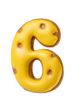 Gingerbread cookie shaped as a number six with bright yellow icing isolated. Transparent PNG image.
