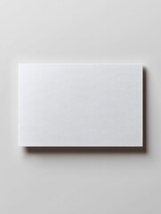 Fototapeta premium Minimalist White Card on a Clean Gray Background with Subtle Shadows