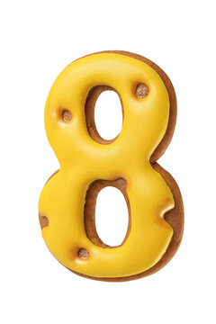 Gingerbread cookie shaped as a number eight with bright yellow icing isolated. Transparent PNG image.