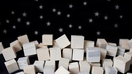 Obraz premium pile of unfinished wooden cubes against a starry background