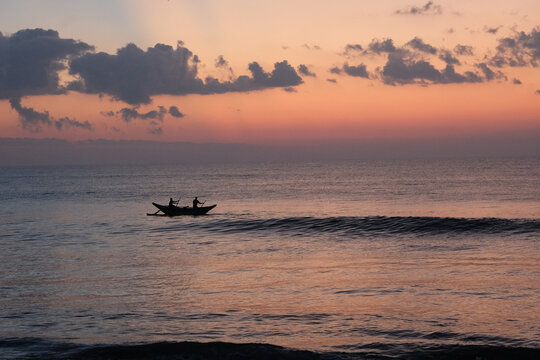 Fishermen silhouetted against Sri Lanka sunset