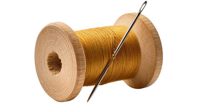 Wooden spool of golden thread with sewing needle