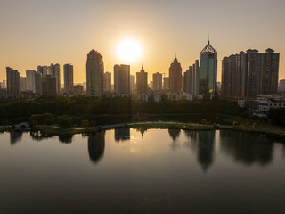 Fototapeta premium Sunset Over Nanning Skyline Reflecting on Lake, Guangxi Province, China