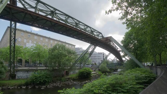 Wuppertal Germany Suspension Railway Passing Above the Wupper River on a Cloudy Day