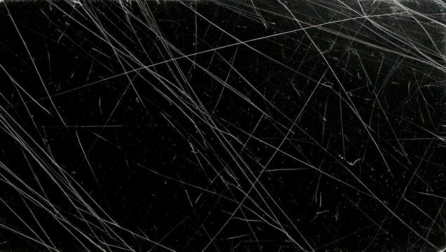 Black Grunge Texture with Scratches and Light Streaks