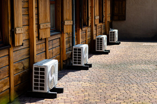 Air conditioning units outside wooden rustic building