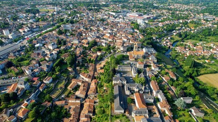 Fototapeta premium Aerial view beside the old town of the city Parthenay, France on a sunny summer highnoon