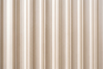 Obraz premium Corrugated beige metal texture with smooth vertical lines