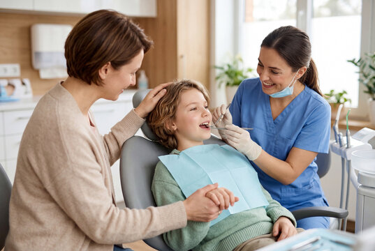 Young child having dental checkup with supportive parent