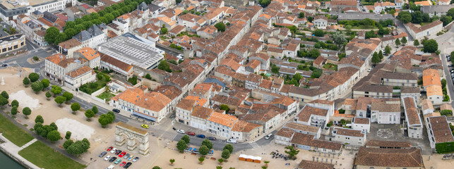 Obraz premium Aerial view beside the old town of the city Surgeres, France on a sunny summer high noon