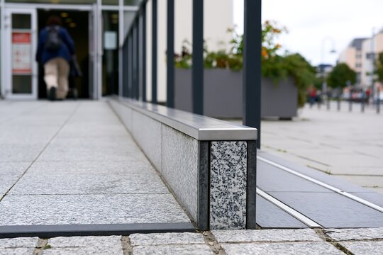 Urban granite pathway leading to building entrance