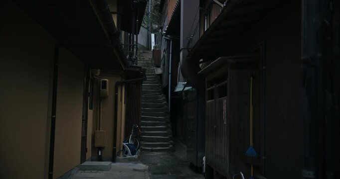 Narrow Alley with Stone Stairs Between Traditional Buildings Japan - Tracking Shot
