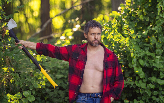 Hispanic lumberjack man with axe. Lumberjack axe. Man sweating logging axe. Brutal man in shirt. Lumberjack hardworking outdoor. Brutal lumberjack. Brutality and masculinity. Heavy tool