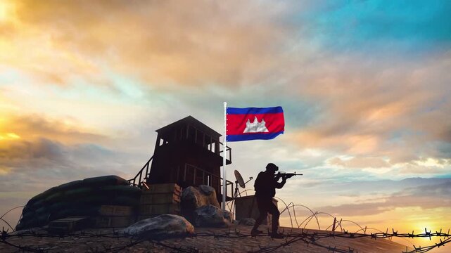 A Cambodian soldier silhouette standing guard at a military outpost with the national flag waving at sunset footage
