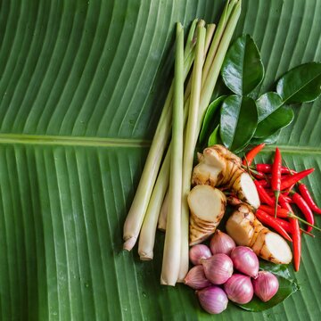 Tom yum ingredients on banana leaf with lemongrass and fresh chilies