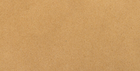 Fototapeta premium Brown recycled paper texture background,Macro,A close-up view of a natural brown recycled paper texture, showing a rough, organic surface with subtle fibers and earthy tones, perfect for eco-friendly 