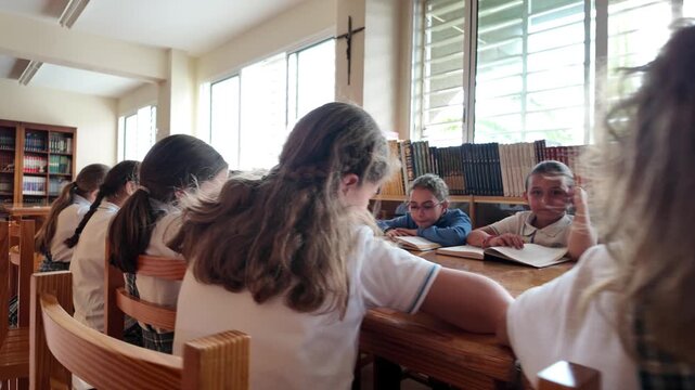 Group of Primary School Students Studying in Library