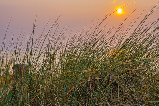 Beautiful sunset over the North Sea at the beach of Egmond aan Zee.