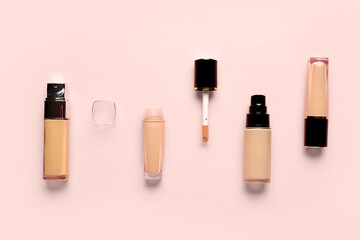 Obraz premium Bottles of makeup foundation on pink background