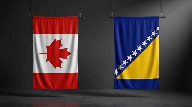 Canadian and bosnian flags hanging vertically on dark background