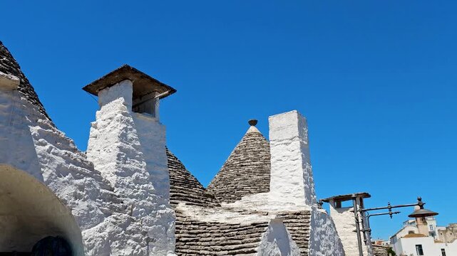 4K video footage of Alberobello city with traditional white trulli houses, charming Puglia village architecture and UNESCO heritage atmosphere in Italy