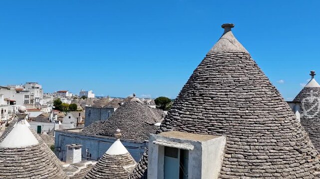4K video footage of Alberobello city with traditional white trulli houses, charming Puglia village architecture and UNESCO heritage atmosphere in Italy