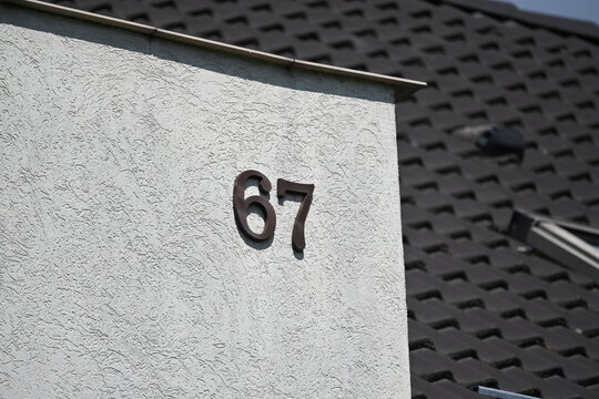 House Number 67 on Building Facade