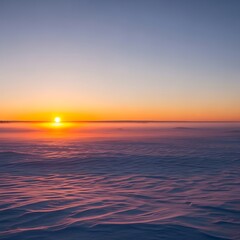 Obraz premium Golden sunset over calm ocean horizon with warm sky.