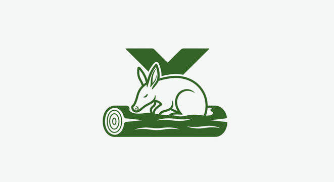Green Aardvark Logo Resting on Log Design.
