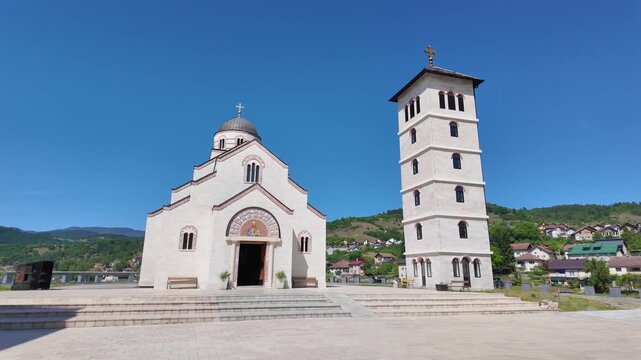 Andricgrad, Visegrad, Bosnia and Herzegovina May 30, 2026 Church of Saint Prince Lazar and bell tower overlooking the central square of Andricgrad