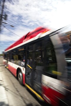 ICM Blurred city bus in motion on urban street