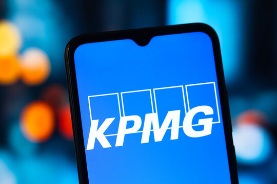In this photo illustration, the KPMG logo is seen displayed on a smartphone screen.