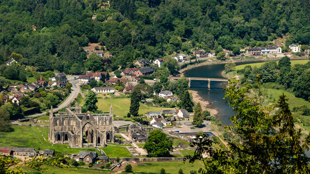 High angle view of Tintern Abbey ruins in the Wye Valley landscape next to the river from Devil's Pulpit