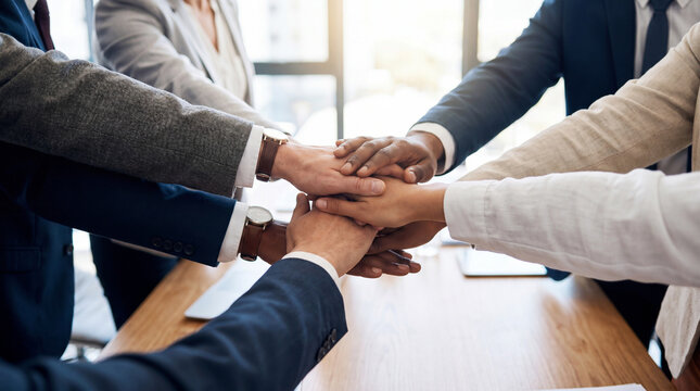 Diverse business team hands stack in office, teamwork and cooperation among professional employee in meeting room