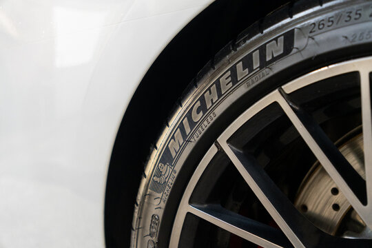 Michelin Pilot Sport 4S Tires wheel on white car BMW M2. Michelin Pilot Sport summer model tire logo close up view. Michelin is a French tire manufacturer based in France. A fragment of a wheel. 