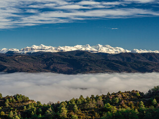 Pyrenees mountains with snow and a sea of clouds © Paul