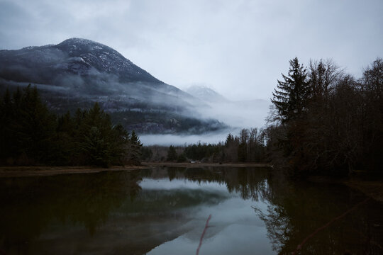 Mountain reflection in still water at evening time