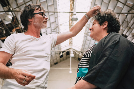 Hairstyling Between Two Friends in industrial loft
