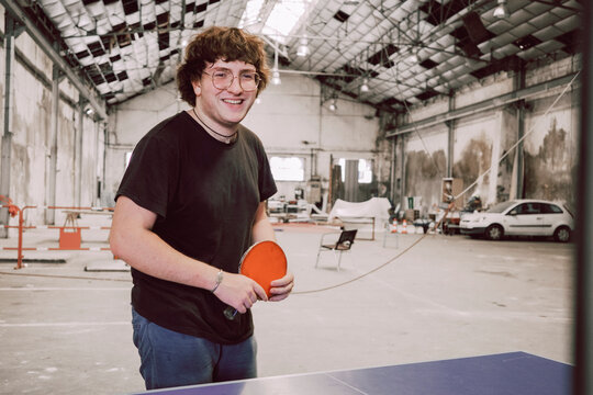 Smiling Player Enjoying Table Tennis