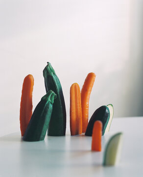 A group portrait of seasonal vegetables, zucchini, and carrots.