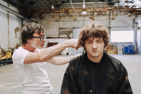 Portrait hairdresser and his client