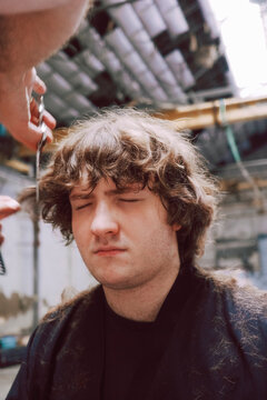 Portrait of z generation teen Getting a Haircut 