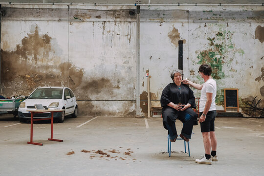Haircut Session in an Empty Warehouse
