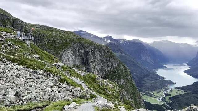 Person Riding a Zipline High Above the Mountains of Loen, Norway